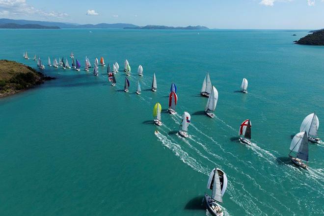 The scenery is one of the things that keeps bringing Ross Wilson and his yacht, Eagle Rock, back to Audi Hamilton Island Race Week. Here, part of the regatta fleet heads away from the island and towards the Whitsunday Passage. © Andrea Francolini/AUDI